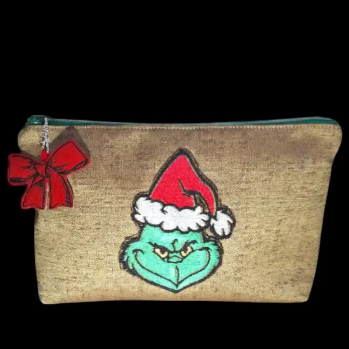 pochette artigianale in tessuto impermeabile con ricamo del Grinch